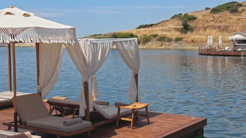 Luxury Beach Club Floating Platform with Cabanas and Sun Loungers Sea View 4K Stock-Footage 336702877
