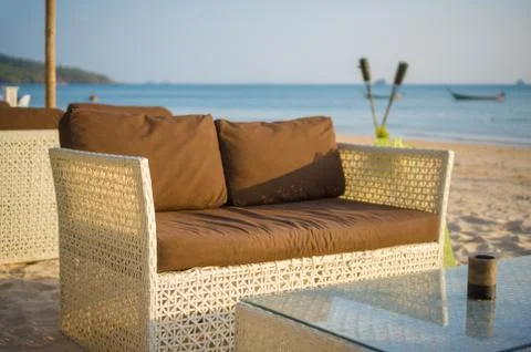 Luxury beach sofa and table on tropical island beach Stock Photos
