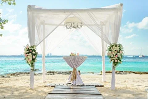 Luxury beach wedding ceremony setup with ocean view Stock Photos