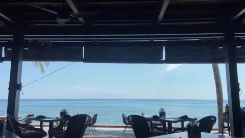 Luxury Beachfront Restaurant View with Tropical Ocean Horizon Stock Footage 340435419