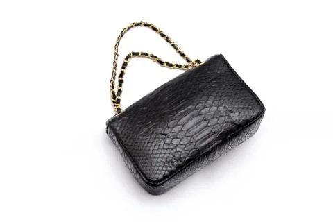Luxury black snakeskin python leather handbag isolated on a white background. 스톡 사진