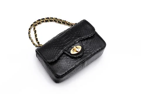 Luxury black snakeskin python leather handbag isolated on a white background. 写真素材