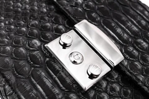 Luxury black snakeskin python leather handbag isolated on a white background. 写真素材
