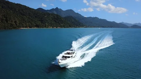 Luxury boat aerial view, luxurious yacht moving fast in blue sea Stock Footage