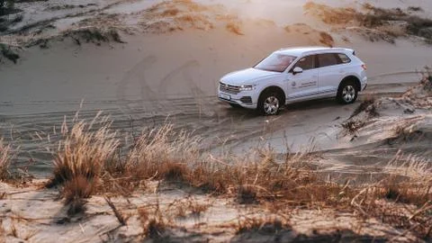 Luxury car in desert Stock Photos