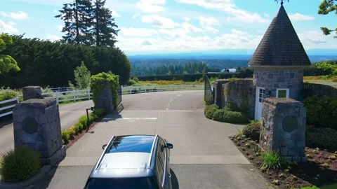 Luxury Car driving through a gate into a country road Stock-Footage 168856820
