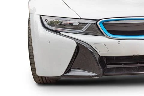 Luxury car front section close-up with white bumper and headlight 库存照片