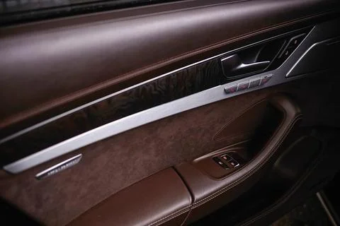 Luxury car interior door panel detail Фото