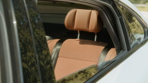 Luxury Car Interior Showing Premium Brown Leather Seat with Seatbelt Stock Footage 343379374