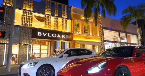 Luxury cars driving on Rodeo Drive in Be, Stock Video