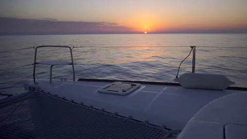 Luxury catamaran sailing during sunset. Stock Footage 82808177