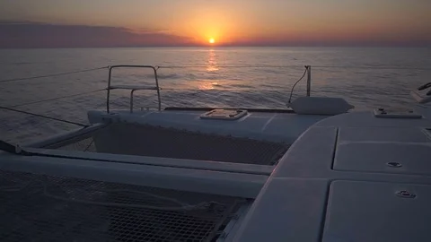 Luxury Catamaran Sailing Through Aegean Sea During Colourful Sunset. Stock Footage 82808167