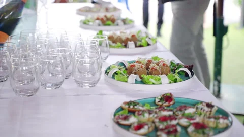 Luxury catering service table on exit celebration party, food trays and crystal Stock-Footage 266172174