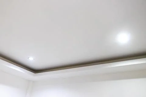 Luxury ceiling lights installed on a white ceiling in elegant Thai hotel in.. Stock Photos