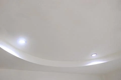 Luxury ceiling lights installed on a white ceiling in elegant Thai hotel in.. Stock Photos