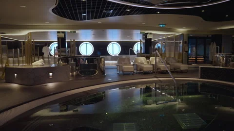 Luxury cruise ship spa interior with pool and round portholes. Stock Footage 340187734