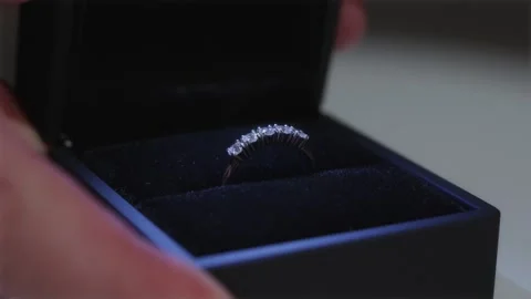 Luxury diamond engagement ring with five stones in a black matte box Stock Footage 334549382