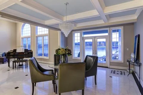 Luxury dining area features coffered ceiling  Stock Photos