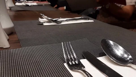 Luxury Dining Table Setup With Stainless Cutlery Grid Mat Tissue And Menu Choice Stock Footage 317943069
