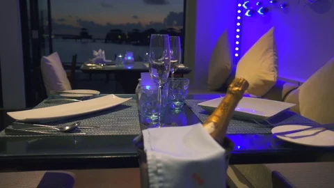 A luxury fine dining table dinner setting with champagne and empty plates. Stock Footage 73452206