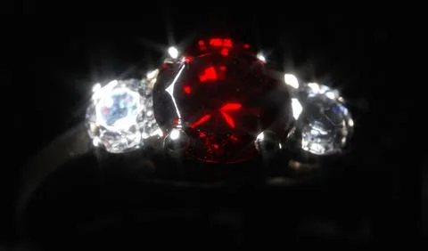 Luxury gold ring with ruby and diamonds. Stock Photos