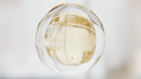 Luxury golden serum liquid bubble. Beauty cosmetics macro 3D abstract background Stock Footage 342908420