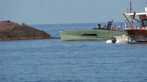 A luxury green power boat returns to port in Ibiza, Spain. Stock Footage 222066653