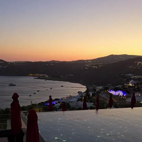 Luxury Hillside Resort Infinity Pool and Restaurant at Sunset Stock Footage 339880630