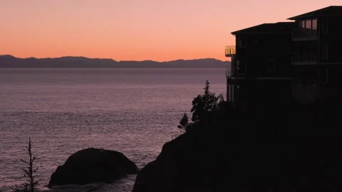 Luxury homes overlooking the ocean at sunset on Vancouver Island, West Coast Video stock 263669910
