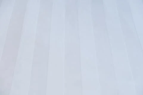 Luxury hotel bed sheet texture with subtle stripe pattern background Stock Photos