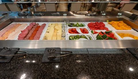 Luxury hotel breakfast buffet with cold cuts, cheese, salad, watermelon, ma.. Stock Photos