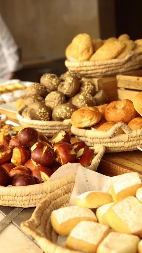 Luxury hotel breakfast buffet or bakery market with fresh baked bread rolls Stock Footage 312633231