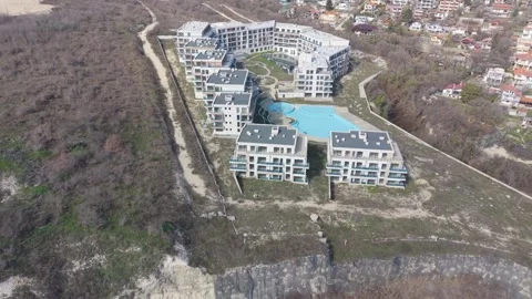 Luxury hotel complex from above with pool courtyard and modern architecture Video stock 331713070