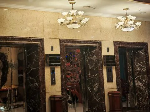 Luxury hotel elevator lobby interior with marble walls and decorative ceilin 스톡 사진