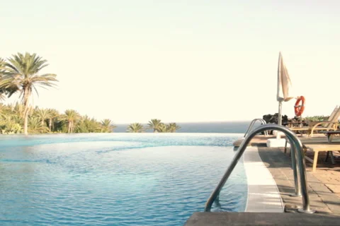 Luxury Hotel infinity pool Stock Footage