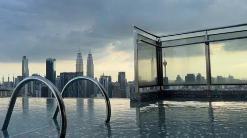 Luxury hotel Infinity pool view of Kuala Lumpur skyline in Malaysia Petronas KL Stock Footage 339750763