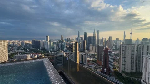 Luxury hotel Infinity pool view of Kuala Lumpur skyline in Malaysia Petronas KL Stock Footage 339750805