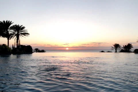 Luxury Hotel Pool at sunset Stock Footage 1080348