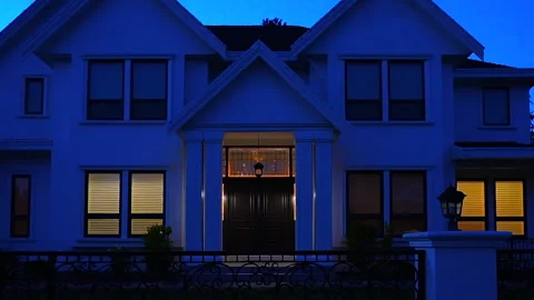 Luxury house with garage door, big tree and nice landscape at night Stock Footage