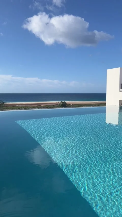 Luxury infinity pool ocean view resort Fuerteventura clear water HD vertical 스톡 동영상 342027769