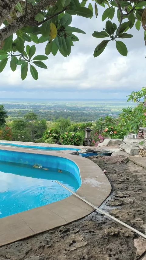 Luxury Infinity Pool Overlooking Lush Tropical Valley in Bali Stock Footage 340464646