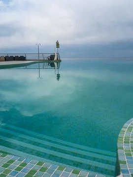 Luxury Infinity Pool Overlooking Lush Greenery Stock Photos