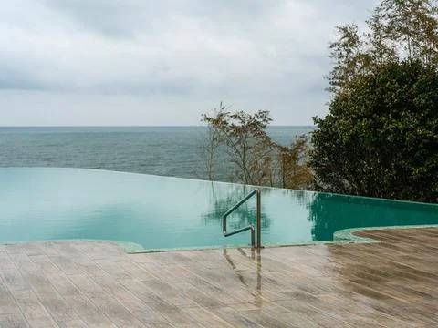 Luxury Infinity Pool Overlooking Lush Greenery Stock Photos