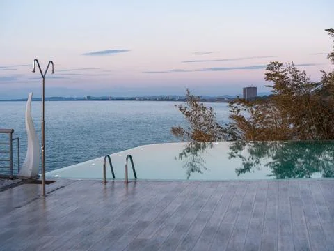 Luxury Infinity Pool Overlooking Lush Greenery Stock Photos