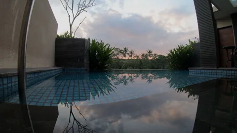 Luxury Infinity Pool Reflection at Tropical Dawn Stock Footage 332594211