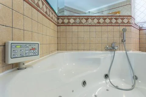 Luxury Jacuzzi bath. With the control panel. Stock Photos