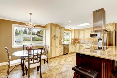 Luxury kitchen interior in light beige color with back splash trim and tile f Stock Photos