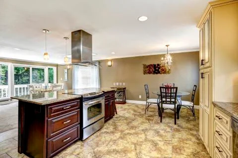 Luxury kitchen interior in light beige color with back splash trim and tile f Stock Photos