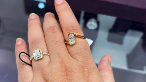 Luxury lab Diamond Rings Worn On Female Hand During Jewelry Shopping Experience Stock Footage 340956915