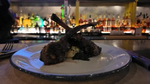 Luxury Lamb Chops Served at an Upscale Restaurant Bar Stock Footage 325428544
